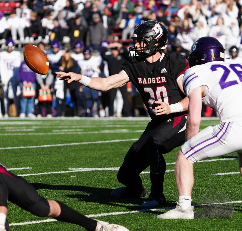 Badger quarterback JP Doyle (20) pitches out during the WIAA Division 2 state championship football game against Waunakee at Camp Randall Stadium in Madison on Friday, November 17, 2023.