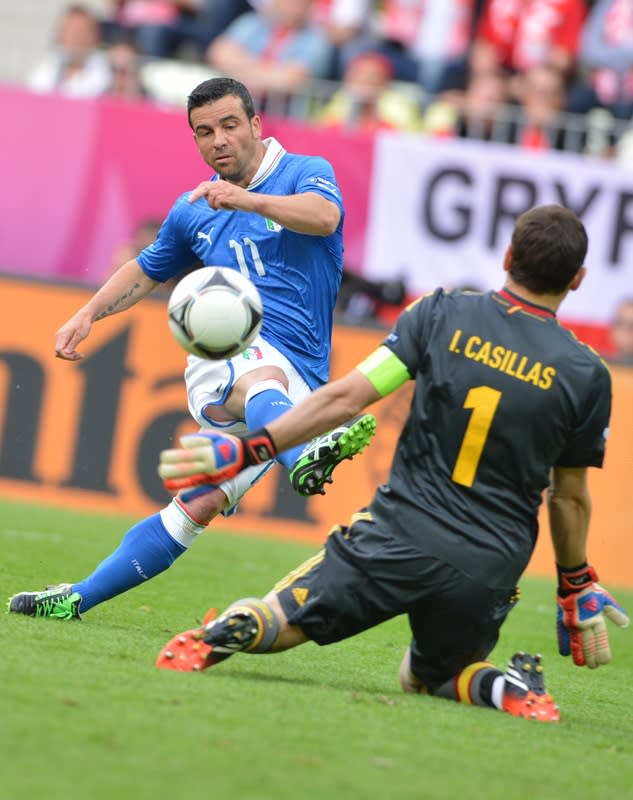 Italian forward Antonio Di Natale (L) scores past Spanish goalkeeper Iker Casillas during the Euro 2012 championships football match Spain vs Italy on June 10, 2012 at the Gdansk Arena. AFPPHOTO/ GIUSEPPE CACACEGIUSEPPE CACACE/AFP/GettyImages