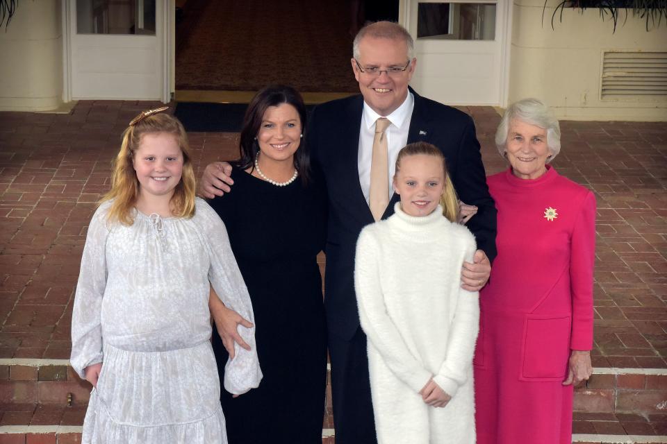 Australian Prime Minister Scott Morrison poses for pictures with his wife Jenny, daughters Abbey (R) and Lily (L), mother Marion Morrison