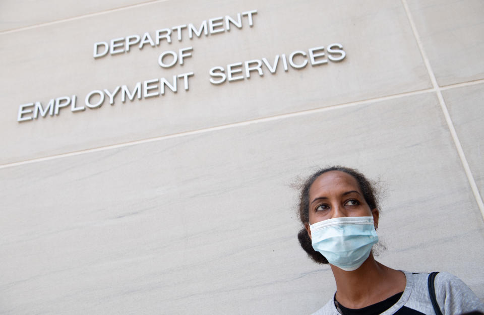 Diana Yitbarek, 44, of Washington, DC, stands outside the DC Department of Employment Services, after trying to find out about her unemployment benefits in Washington, DC, July 16, 2020. - Americans worry as unemployment benefits are due to end soon. (Photo by SAUL LOEB / AFP) (Photo by SAUL LOEB/AFP via Getty Images)