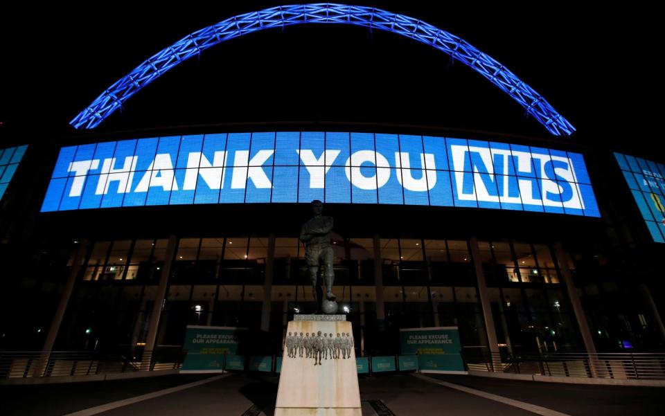 A message reading "Thank you NHS" is displayed at Wembley Stadium, north London - REUTERS 