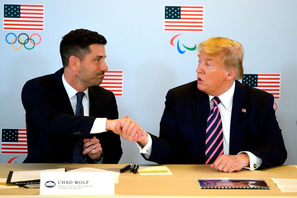 Then-President Donald Trump shakes hands with his Acting Department of Homeland Security Secretary Chad Wolf as he participates in a briefing with the US Olympic and Paralympic Committee and LA 2028 Organizers in Beverly Hills, California, on February 18, 2020. 