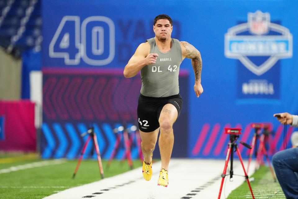 Feb 29, 2024; Indianapolis, IN, USA; UCLA defensive lineman Laiatu Latu (DL42) works out during the 2024 NFL Combine at Lucas Oil Stadium. Mandatory Credit: Kirby Lee-USA TODAY Sports