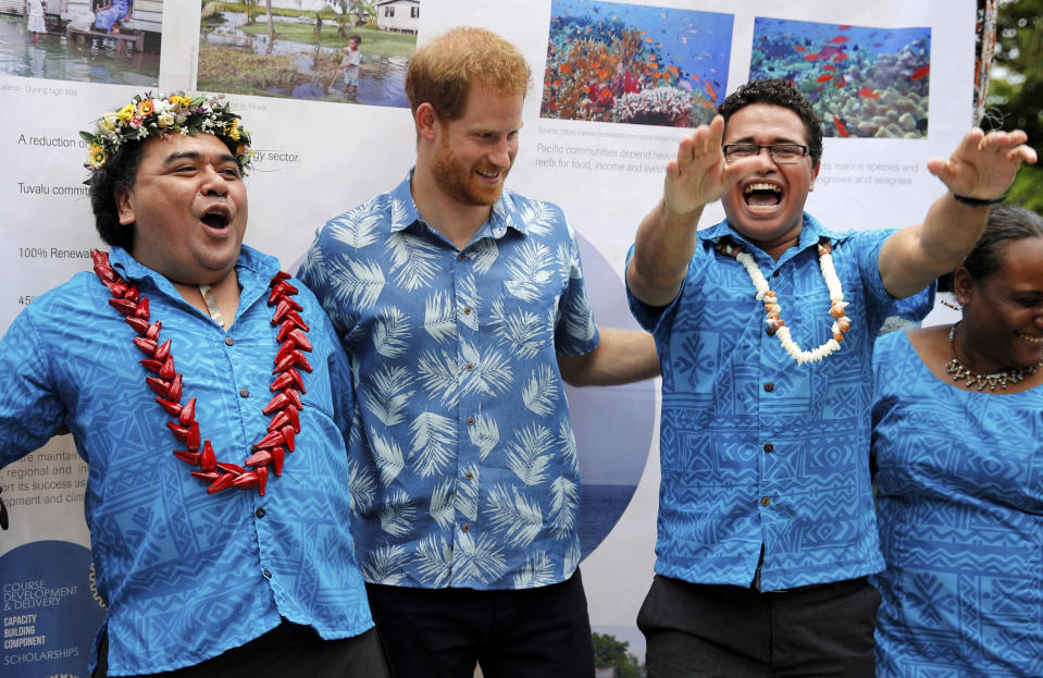 Britain's Prince Harry meets with students during a visit to the University of the South Pacific in Suva, Fiji, Wednesday, Oct. 24, 2018. Prince Harry and his wife Meghan are on day nine of their 16-day tour of Australia and the South Pacific (Phil Noble/Pool Photo via AP)