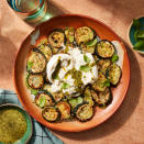 <p>Tender zucchini rounds get topped with creamy burrata and tangy, bright pesto for an easy side dish that's sure to impress. Crushed red pepper adds a light kick of spice to round out the flavors. <a href="https://www.eatingwell.com/recipe/7994048/smashed-zucchini-with-pesto-burrata/" rel="nofollow noopener" target="_blank" data-ylk="slk:View Recipe;elm:context_link;itc:0;sec:content-canvas" class="link ">View Recipe</a></p>