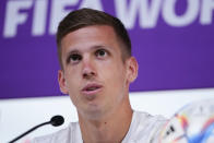 Spain's Dani Olmo speaks to reporters during a news conference, in Doha, Qatar, Saturday, Nov. 26, 2022. Spain will play its second match in Group E in the World Cup soccer tournament against Germany on Nov. 27. (AP Photo/Julio Cortez)