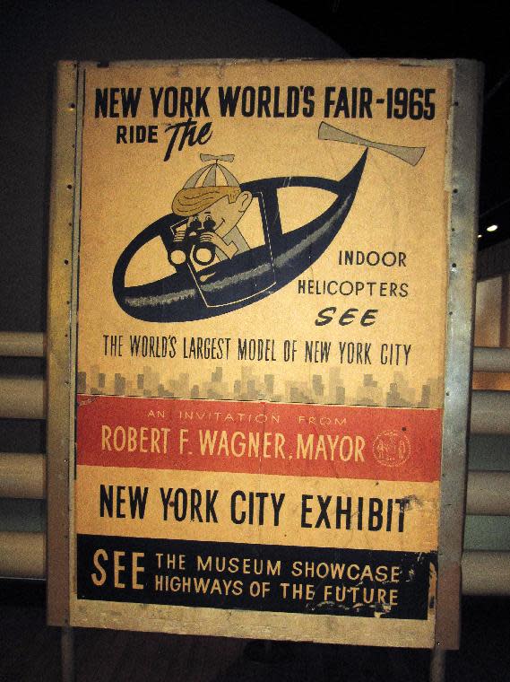 his April 9, 2014 photo shows a poster from the World's Fair in the Queens borough of New York, which first opened 50 years ago in 1964 and returned for a second year in 1965. The poster is on display at the Queens Museum of Art in Flushing Meadows Park along with other artifacts from the fair. (AP Photo/ Beth J. Harpaz)