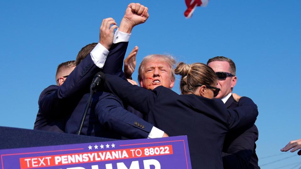 PHOTO: Republican presidential candidate former President Donald Trump is surrounded by U.S. Secret Service agents at a campaign rally, July 13, 2024, in Butler, Pa.  (Evan Vucci/AP)