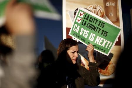 Fast-food workers and their supporters join a nationwide protest for higher wages and union rights outside McDonald's in Los Angeles, California, United States, November 10, 2015. REUTERS/Lucy Nicholson