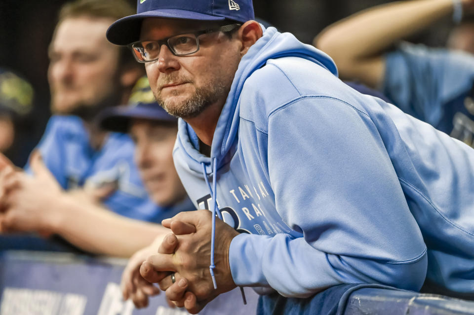 FILE - Tampa Bay Rays pitching coach Kyle Snyder watches from the dugout during the team's baseball game against the Miami Marlins on Sept. 26, 2021, in St. Petersburg, Fla. Snyder injured himself walking toward the mound to visit Shane McClanahan during the seventh inning of a 9-1 loss to the Detroit Tigers on Saturday, Aug. 6. The 44-year-old Snyder had to return to the dugout, and manager Kevin Cash went out to speak with McClanahan instead. (AP Photo/Steve Nesius, File)