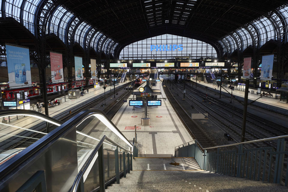 A view of the nearly empty platforms at Hamburg Central Station shortly before the start of the nightly curfew, which begins at 9 p.m. in Hamburg, Germany, Saturday, April 24, 2021. Beginning Saturday, a federal emergency curfew rule will apply to counties with a seven-day incidence of more than 100 new coronavirus infections. This includes, but is not limited to, curfew restrictions between 10 p.m. and 5 a.m. (Georg Wendt/dpa via AP)