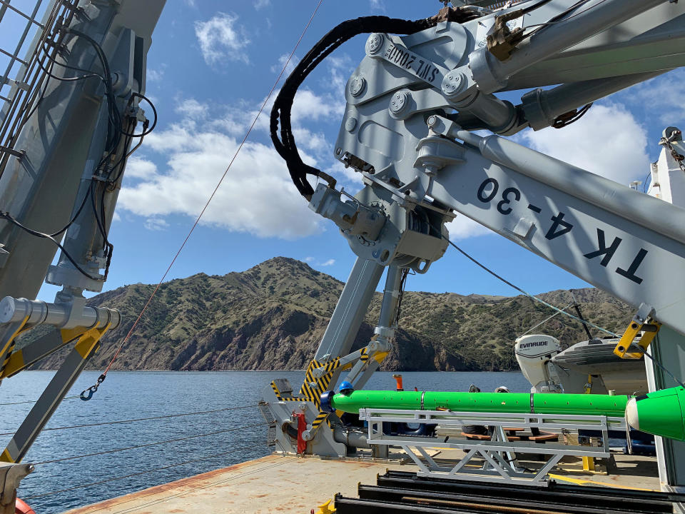 Scripps Researchers aboard the Research Vessel Sally Ride using the REMUS 600 and Bluefin automated underwater vehicles (AUVs) to survey the seafloor for discarded DDT barrels in March 2021. / Credit: Scripps