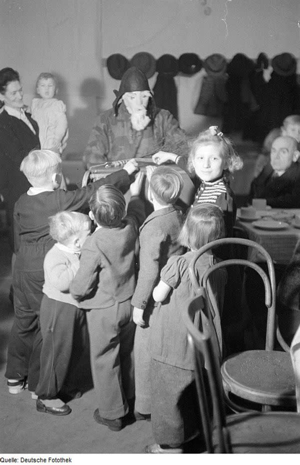 Socialist Unity Party of Germany Handing out Christmas Present in Reinickendorf neighborhood of Berlin, Germany, 1946