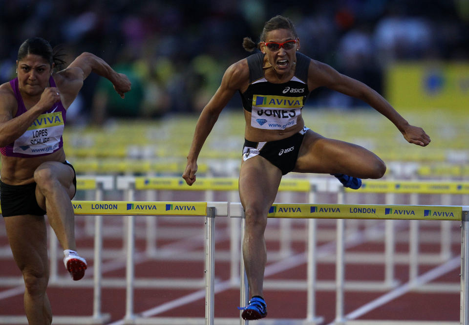 LONDON, ENGLAND - AUGUST 13: Lolo Jones of the USA (r) is beaten by Priscilla Lopes-Schliep of Canada in the Womens 100 metres hurdles race during the Aviva London Grand Prix at Crystal Palace on August 13, 2010 in London, England. (Photo by Stu Forster/Getty Images)