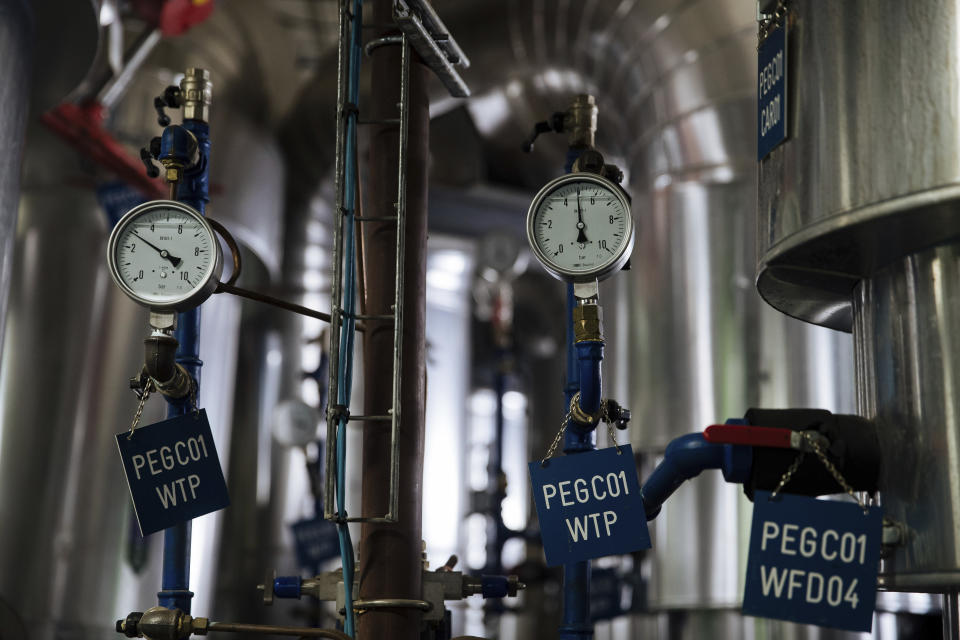 A pressure gauge works at one of the Fraicheur de Paris' underground cooling sites on Tuesday, July 26, 2022, in Paris. The system, which uses electricity generated by renewable sources, is the largest in Europe and goes unnoticed above ground. (AP Photo/Lewis Joly)