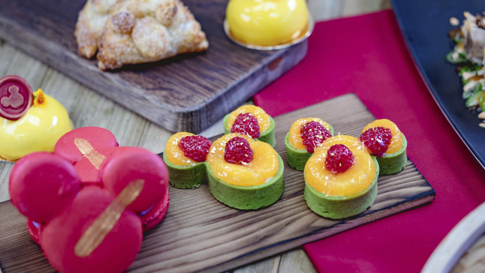 This undated photo provided by Disneyland Resort shows Mickey Mouse-shaped mandarin orange-green tea tarts from the Lucky 8 Lantern marketplace at Disney California Adventure Park in Anaheim, Calif. In recent years, the Lunar or Chinese New Year seems to have achieved all-American status as major companies are celebrating, and capitalizing on the holiday. (Disneyland Resort via AP)