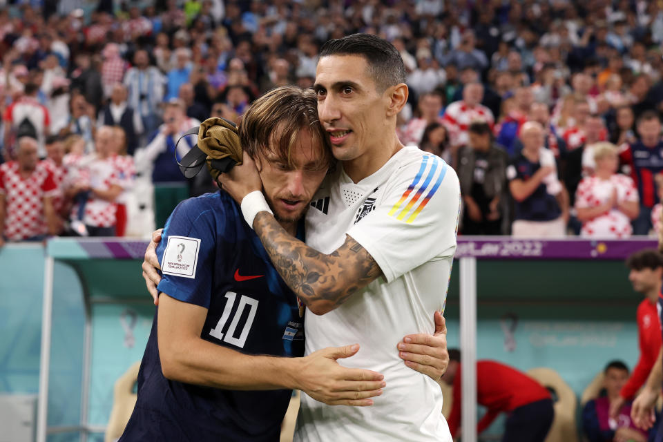 Pictured left, Croatia captain Luka Modric is consoled by Argentina's Angel Di Maria after being knocked out in the semi-finals of what could be his final World Cup game. 