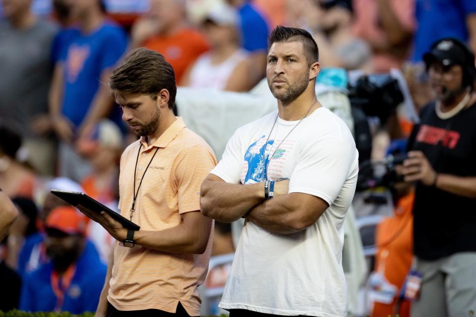 Former Florida Gators quarterback Tim Tebow watches the game from the sidelines during the first half against the Kentucky Wildcats at Steve Spurrier Field at Ben Hill Griffin Stadium in Gainesville on Saturday, Sept.10, 2022.