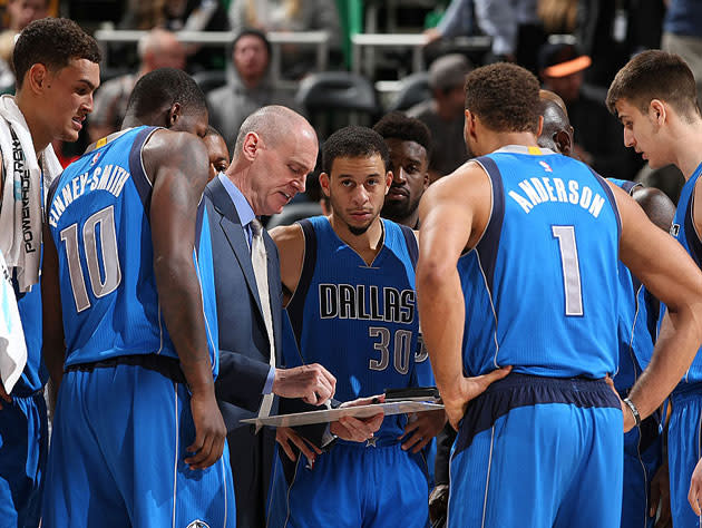 Rick Carlisle, to the consternation of his innocent players, draws up a bad play. (Getty Images)