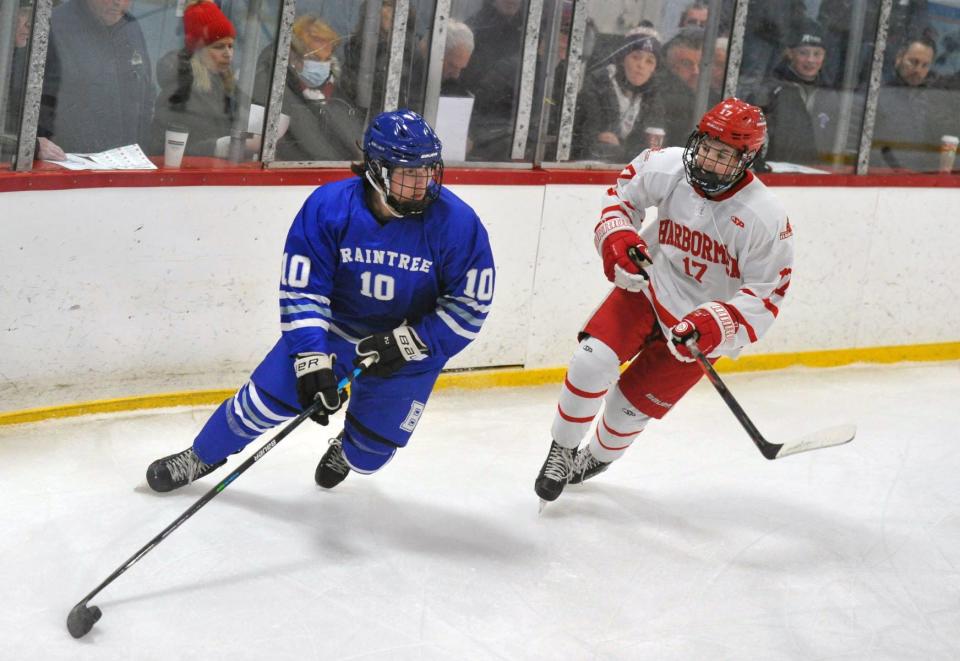 Braintree's Deni Tabaku, left, races past Hingham's Danny Carroll during boys hockey at Pilgrim Arena in Hingham, Saturday, Jan. 15, 2022.