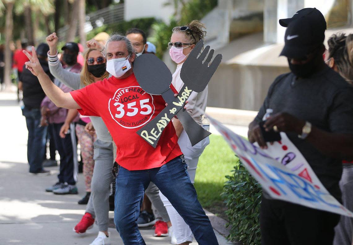 Diplomat Beach Resort workers protest in Hollywood, Florida, Friday, March 12, 2021. Workers protested in front of the hotel to demand their jobs back after being laid off for about a year.