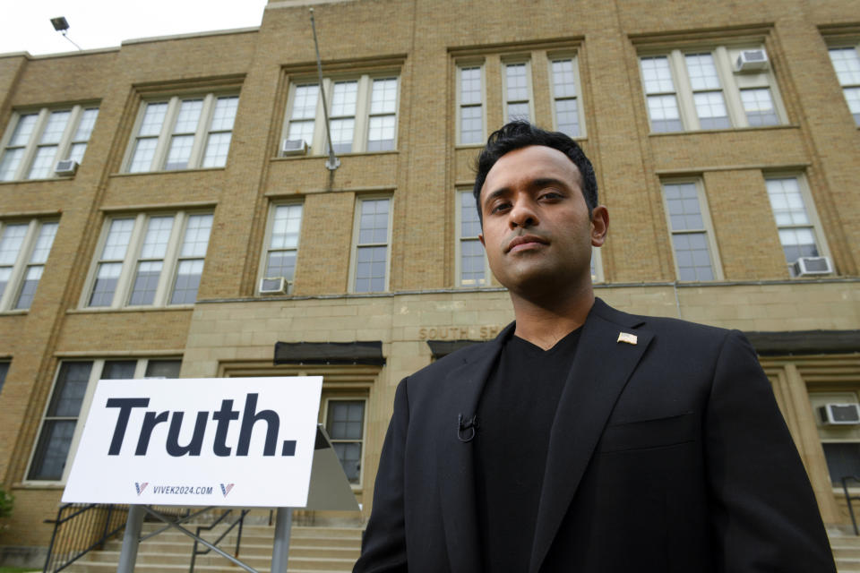 Republican Presidential candidate Vivek Ramaswamy poses for a photo outside the shuddered former South Shore High School where the city of Chicago is planning to house illegal migrants Friday, May 19, 2023, in Chicago. (AP Photo/Paul Beaty)