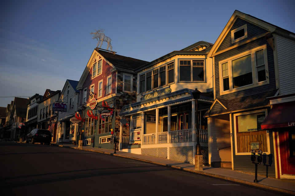Early-morning light shines on shops on Main Street, Saturday, June 11, 2022, in Bar Harbor, Maine. Small businesses face a mix of old and new challenges as 2023 begins. / Credit: Robert F. Bukaty / AP