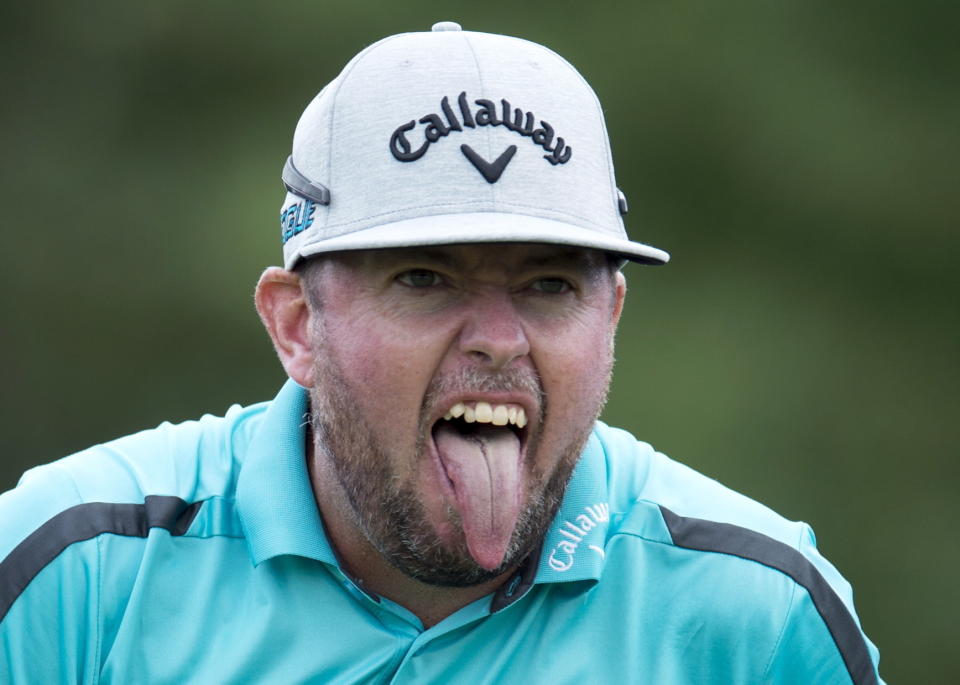 Robert Garrigus reacts to his tee shot on the 17th hole during the first round of the the Canadian Open golf tournament at Glen Abbey in Oakville, Ontario, Thursday, July 26, 2018. (Frank Gunn/The Canadian Press via AP)