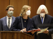 Actor Danny Masterson, left, stands with his lawyers Thomas Mesereau, right, and Sharon Appelbaum during his arraignment in Los Angeles Superior Court in Los Angeles, Friday, Sept. 18, 2020. "That '70s Show" actor Masterson was arraigned on three rape charges. (Lucy Nicholson/Pool Photo via AP)