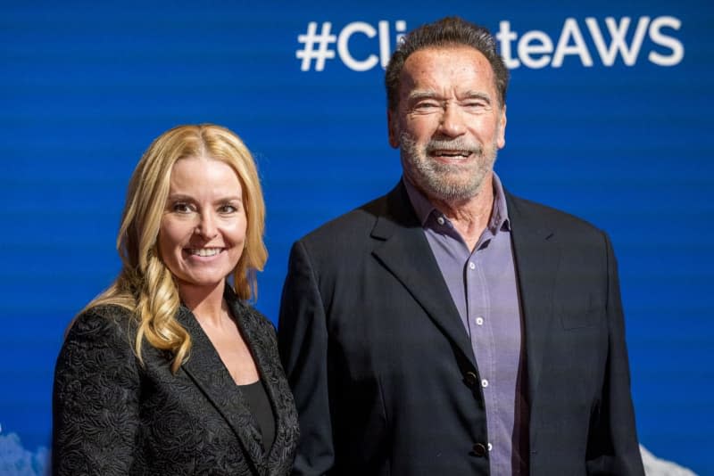 Austrian and American actor and former governor of California Arnold Schwarzenegger (R) and his partner Heather Milligan attend a "Special Dinner for Climate Action" press event as part of the Ski World Cup at the Stanglwirt in Kitzbuehel. Johann Groder/APA/dpa