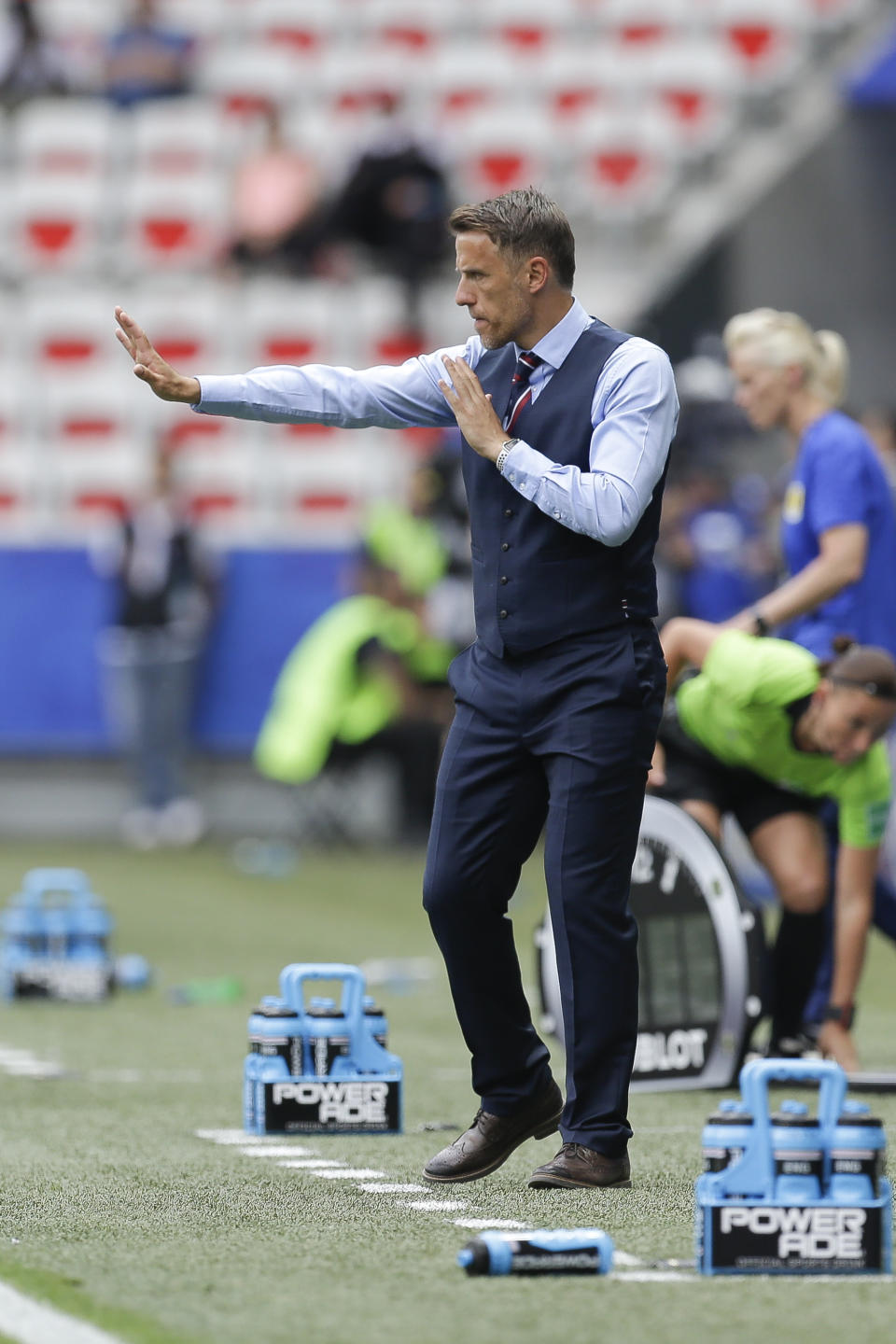 England head coach Philip Neville gives direction to the players during the Women's World Cup Group D soccer match between England and Scotland in Nice, France, Sunday, June 9, 2019. (AP Photo/Claude Paris)