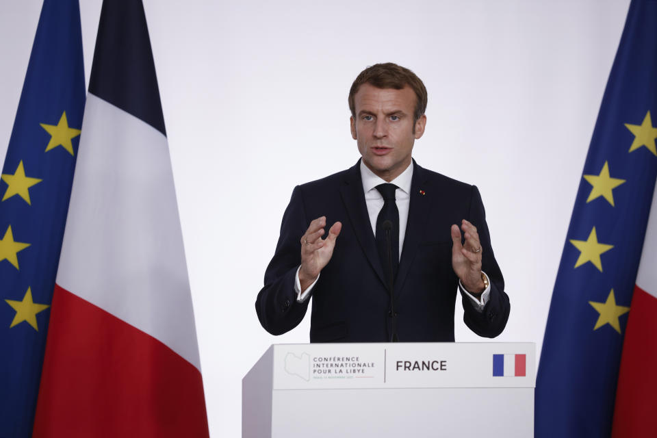 French President Emmanuel Macron speaks during a press conference folowing a conference on Libya in Paris Friday, Nov. 12, 2021. France is hosting an international conference on Libya on Friday as the North African country is heading into long-awaited elections next month. (Yoan Valat/Pool Photo via AP)