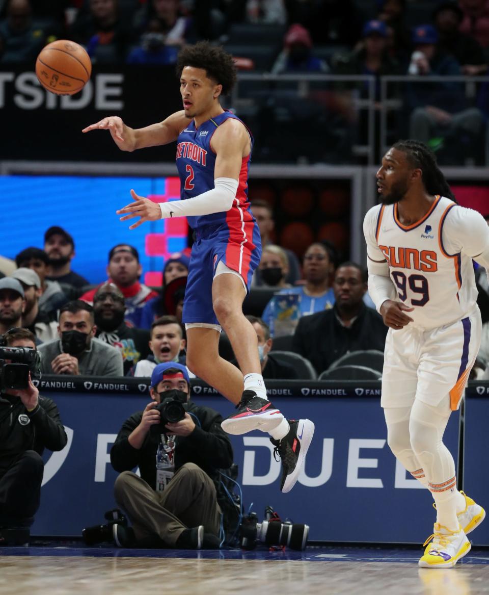Pistons guard Cade Cunningham saves the ball against the Suns during the Pistons' 135-108 loss on Sunday, Jan. 16, 2022, at Little Caesars Arena.