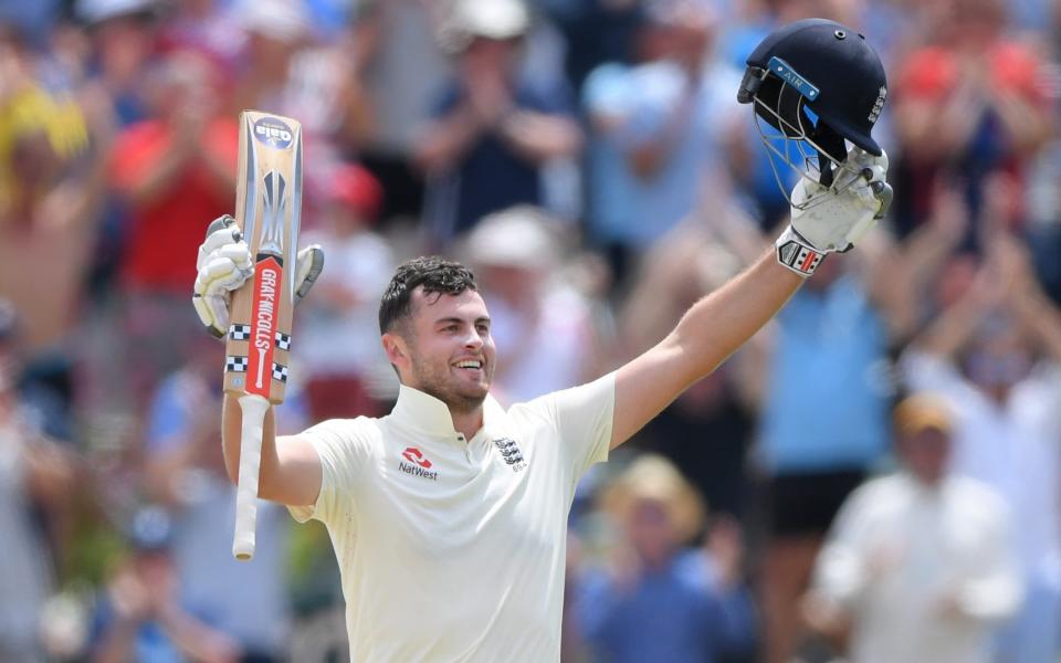 England batsman Dominic Sibley celebrates after reaching his maiden Test century during Day Four of the Second Test between South Africa and England at Newlands - Stu Forster/Getty Images