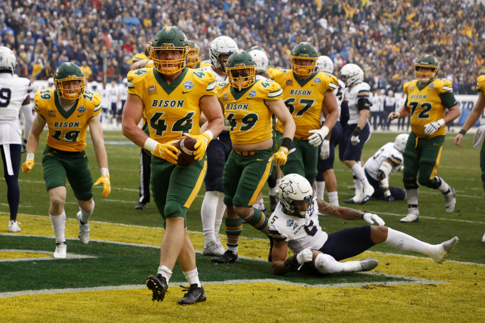 North Dakota State fullback Hunter Luepke (44) celebrates his touchdown against Montana State during the first half of the FCS Championship NCAA college football game in Frisco, Texas, Saturday, Jan. 8, 2022. (AP Photo/Michael Ainsworth)