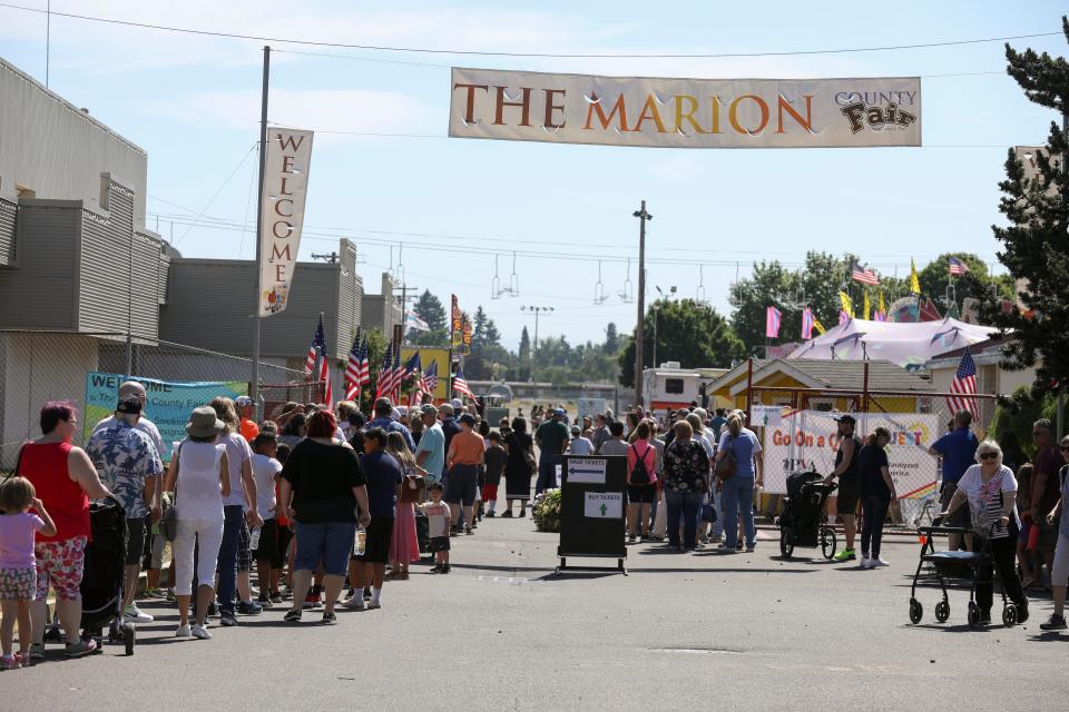 People line up to enter the Marion County Fair on Friday.