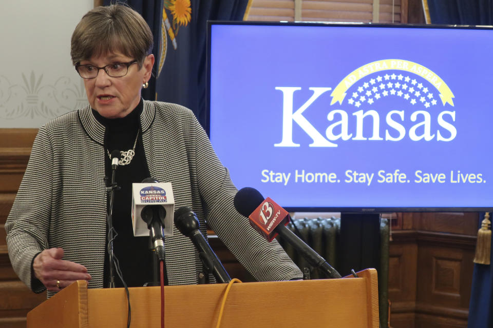 Kansas Gov. Laura Kelly answers reporters' questions about her veto of a sweeping coronavirus bill that would have curbed her power to direct the state's pandemic response during a news conference, Tuesday, May6 26, 2020, at the Statehouse in Topeka, Kan. The Democratic governor issued a new state of emergency and called the Republican-controlled Legislature into special session to extend that state of emergency. (AP Photo/John Hanna)