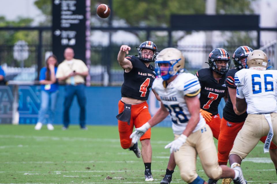 Lake Wales quarterback Trent Grotjan (4) throws a pass intended for Lake Wales wide receiver Carlos Mitchell (2) in the second quarter during the Class 3S football state championship game between Lake Wales and Mainland at DRV PNK Stadium on Friday, December 16, 2022, in Fort Lauderdale, FL.