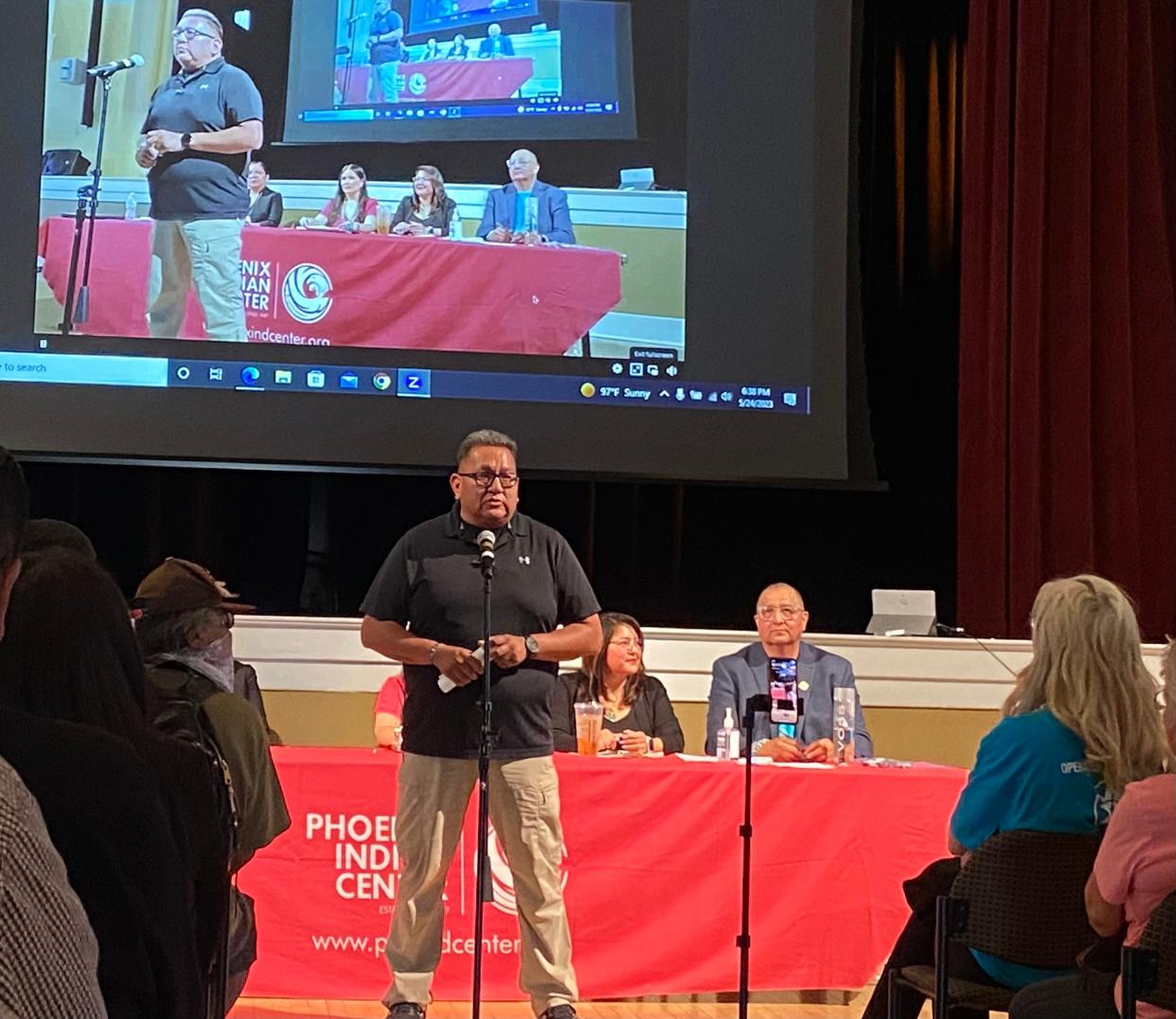 Harland Cleveland speaks to the audience at the Memorial Hall at Steele Indian School Park on May 24, 2023, during the Operation Rainbow Bridge initiative to help displaced Navajos who are victims of fraudulent rehab centers.