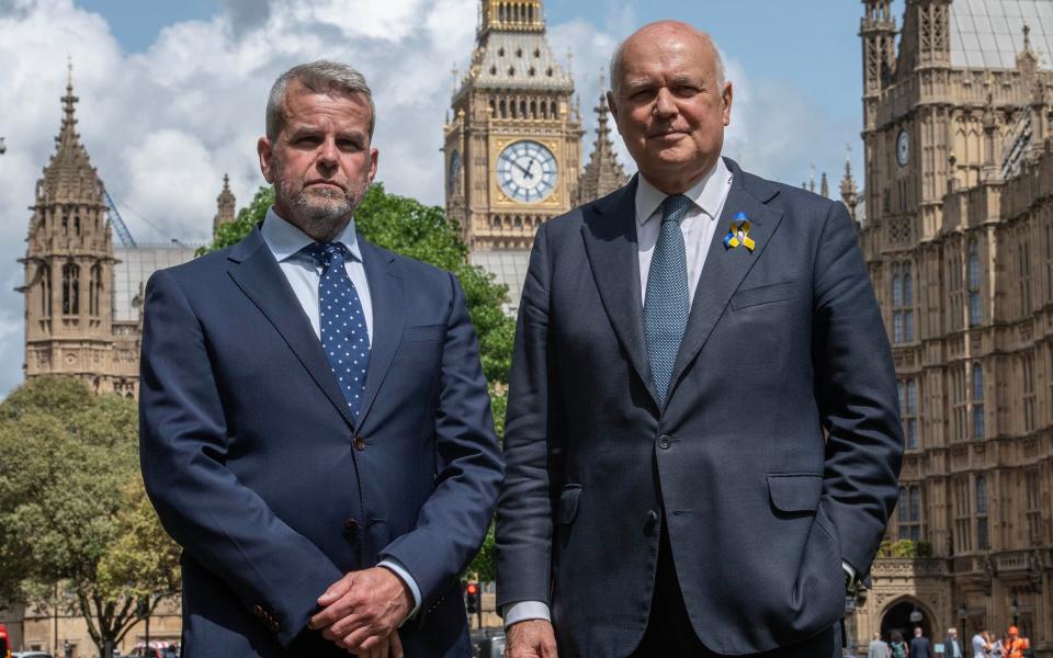 Matt Briggs (left) with Iain Duncan Smith before the House of Commons amendment to the Criminal Justice Bill was passed unanimously by MPs