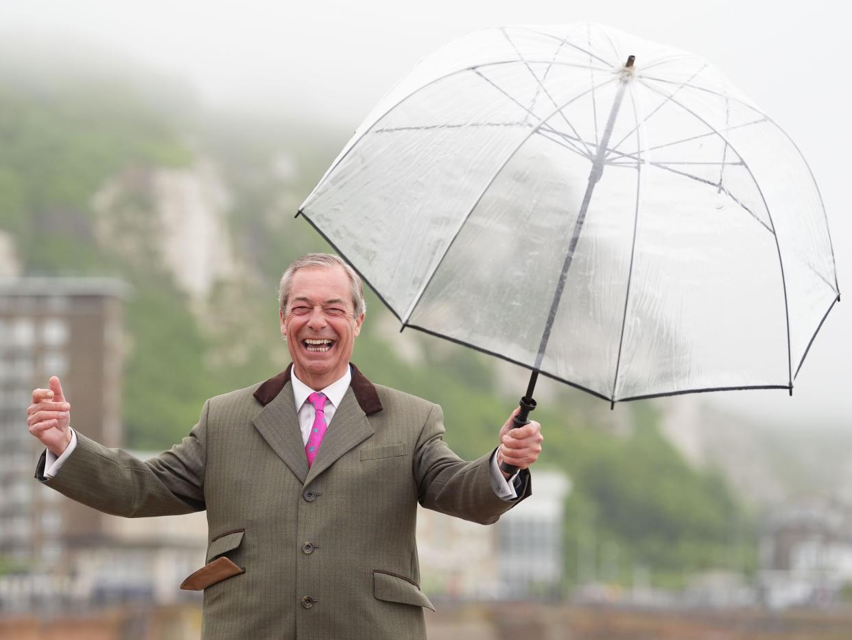 Nigel Farage poses for photographers in Dover, after announcing Howard Cox as the Reform UK candidate for Dover, while on the General Election campaign trail. Picture date: Tuesday May 28, 2024.