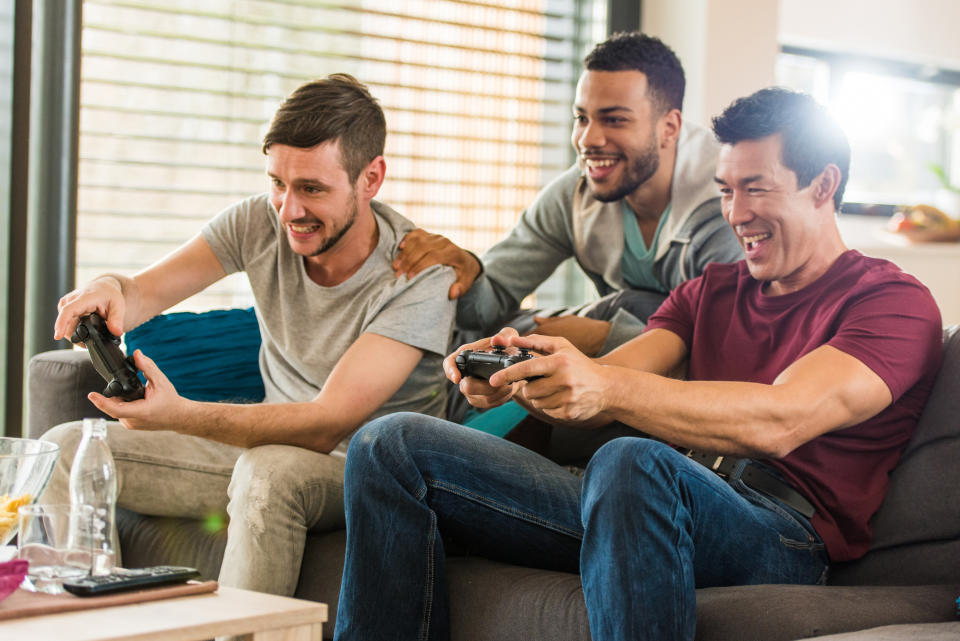 A group of guys playing video games