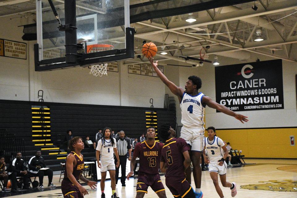 Wellington's Reggie Reinhardt (4) rises for a layup against Hallandale during the South County Martin Luther King Classic on Monday, Jan. 16, 2023.