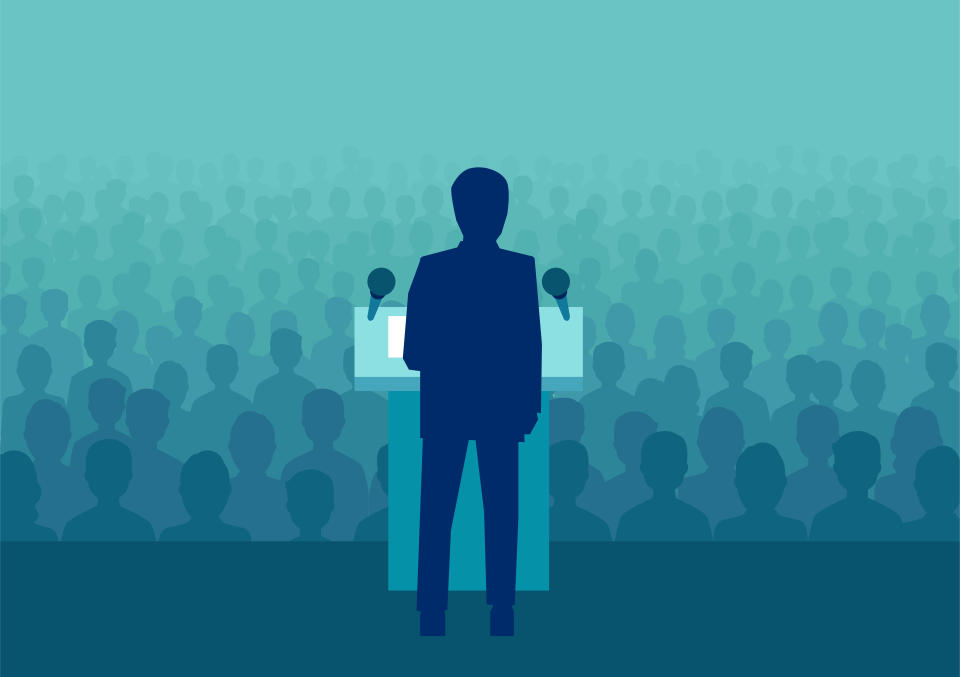 Vector illustration of a businessman or politician speaking to a large crowd of people