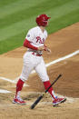 Philadelphia Phillies' Brad Miller watches the ball after hitting a three-run home run off Milwaukee Brewers' Eric Lauer during the third inning of a baseball game, Tuesday, May 4, 2021, in Philadelphia. (AP Photo/Derik Hamilton)