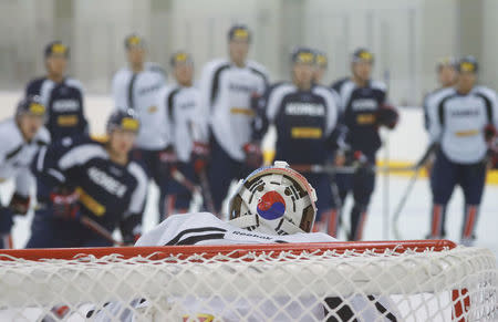 A South Korean national flag is seen on the back of a helmet belonging to a naturalized athlete of South Korean national ice hockey team Matt Dalton during a training session in Jincheon, South Korea, December 1, 2017. Picture taken December 1, 2017. REUTERS/Kim Hong-Ji