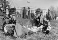 <p>Boys sit in front of the White House during the annual Easter Egg Roll in Washington in 1911. (Photo: Library of Congress) </p>