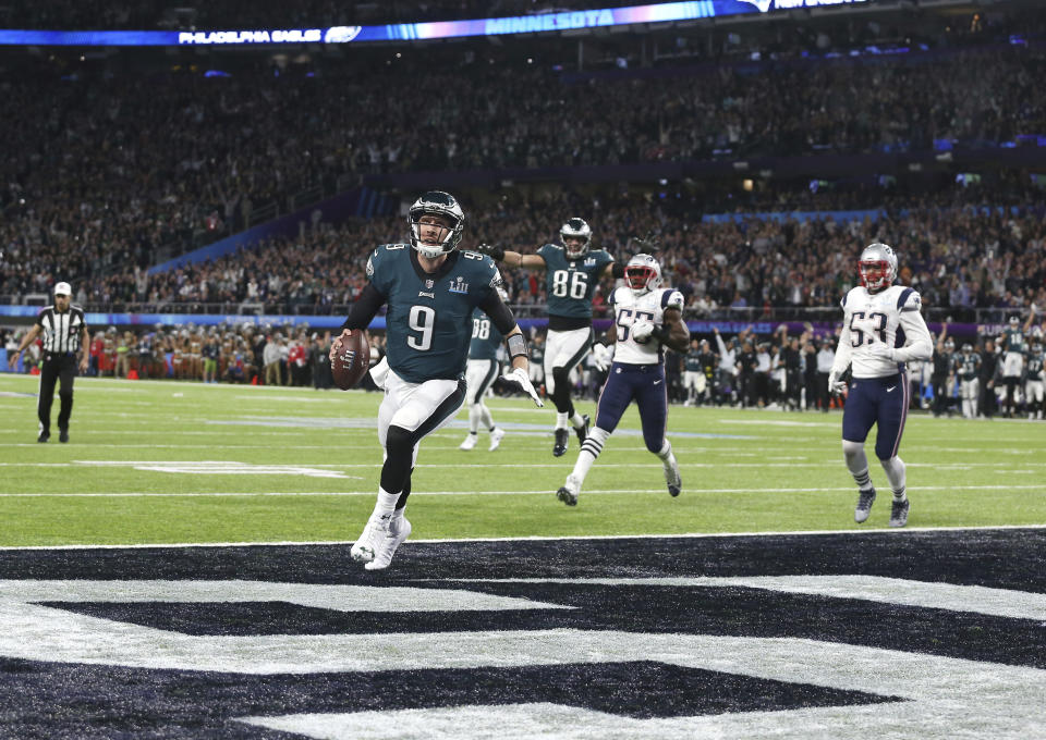 Philadelphia Eagles quarterback Nick Foles (9) catches a touchdown pass from tight end Trey Burton, in the second quarter against the New England Patriots in Super Bowl LII, Sunday, Feb. 4, 2018 in Minneapolis. The Eagles defeated the Patriots 41-33 to win their first Super Bowl. (AP Photo/Doug Benc)