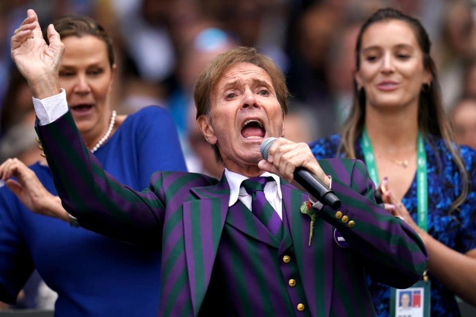 Sir Cliff Richard with backing singers Pam Shriver (left) and Laura Robson (John Walton/PA) (PA Wire)
