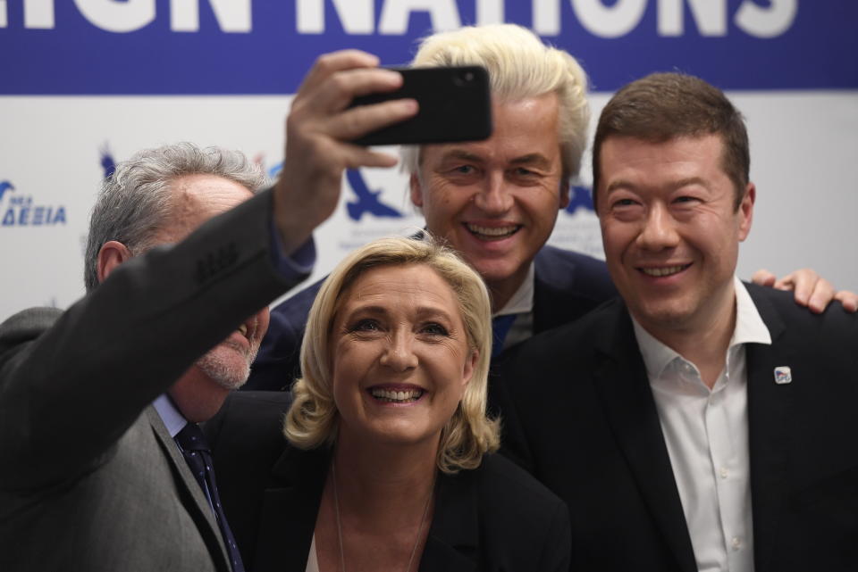 Gerolf Annemans, chairman of the Europe of Nations and Freedom (ENF) EP group, left, leader of the French National Front Marine Le Pen, Czech far-right Freedom and Direct Democracy (SPD) head Tomio Okamura, right, and leader of Dutch Party for Freedom Geert Wilders pose for a selfie during a press conference before the rally against "dictate of European Union" staged by SPD in Prague, Czech Republic, Thursday, April 25, 2019. (Ondrej Deml/CTK via AP)